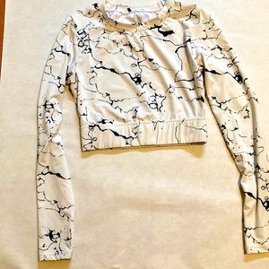 cropped long sleeved athletic shirt with cut out in back